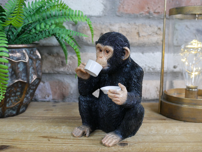 Resin monkey statues with a drinking habit
